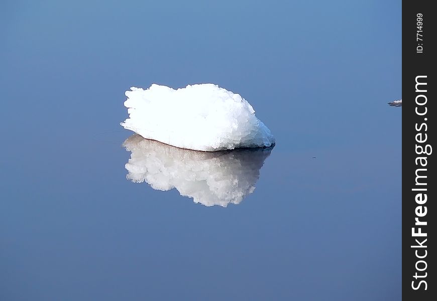 A bit of ice on a water.