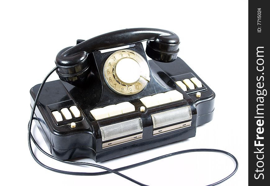 Old telephone on white background