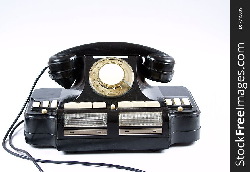 Old telephone on white background