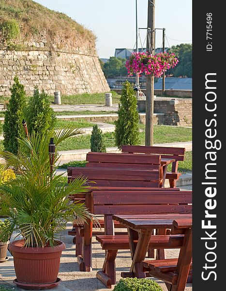 Outdoor cafe tables by river. Outdoor cafe tables by river