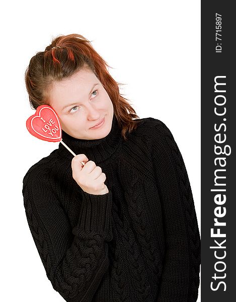 Girl with red heart shaped candy