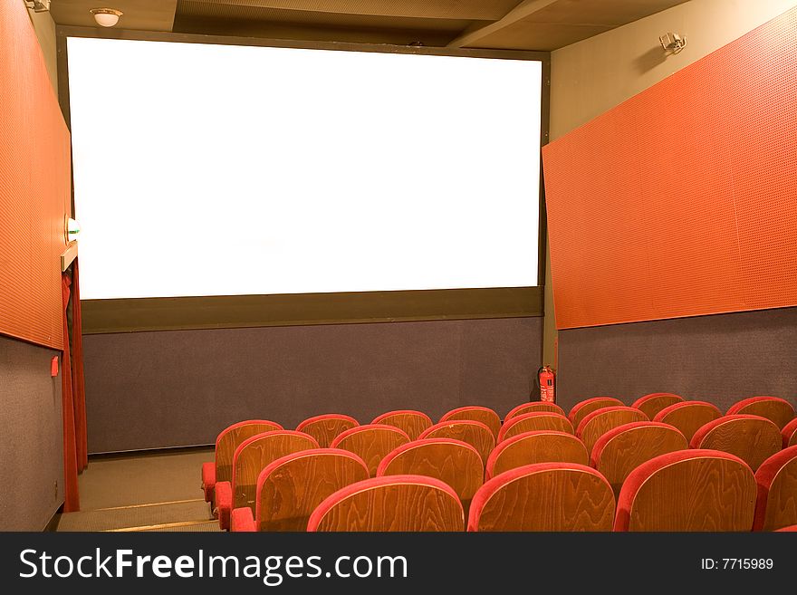 Empty cinema auditorium with chairs