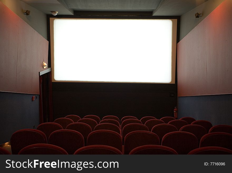 Empty cinema auditorium with chairs