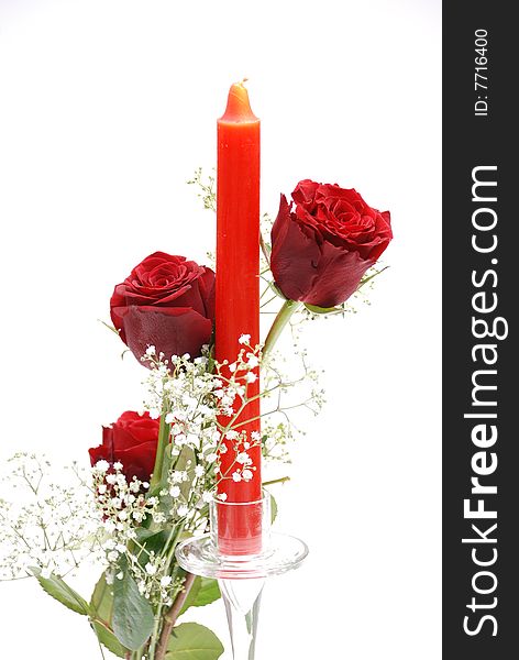 Two Red Roses with candle  isolated on white