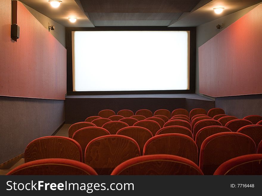Empty cinema auditorium with chairs
