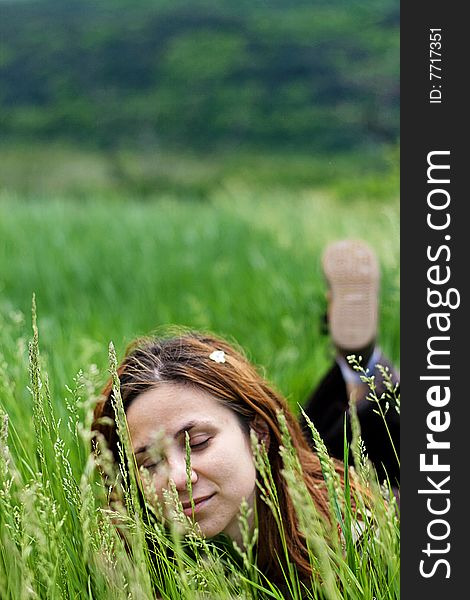 Beautiful Girl Lying Down Of Grass