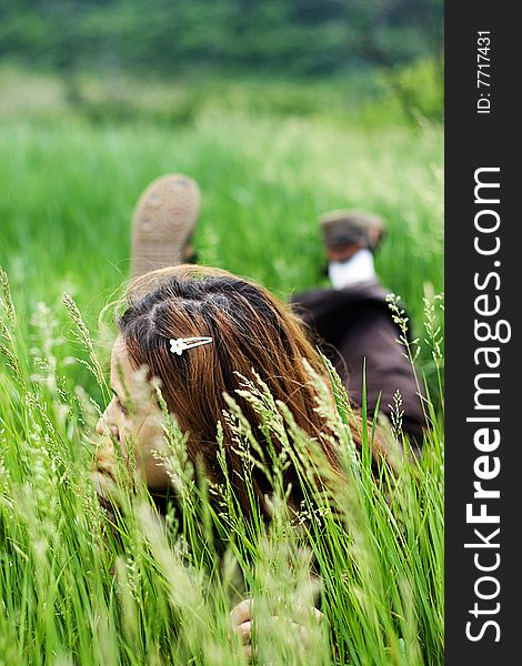 Beautiful Girl Lying Down Of Grass