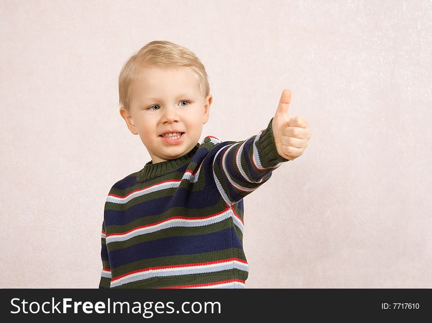 Cheerful little boy shows his positive future. Cheerful little boy shows his positive future