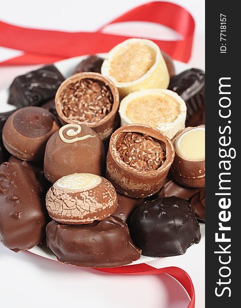 Assorted chocolates isolated on white
