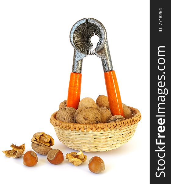 Nutcracker, walnuts and hazel isolated on white background. Nutcracker, walnuts and hazel isolated on white background