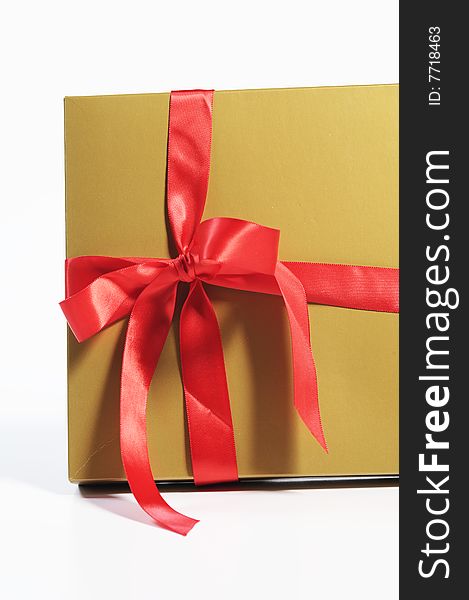 Gift box with red ribbon isolated on white