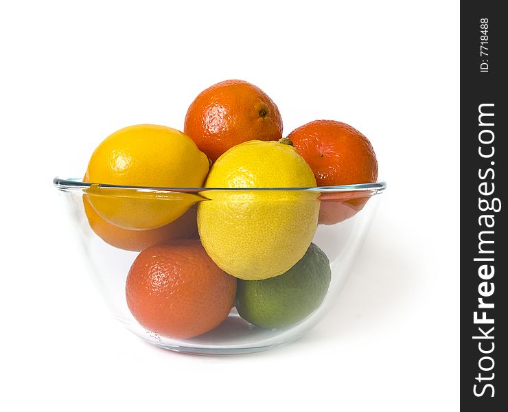 Bowl of citrus fruits on white background