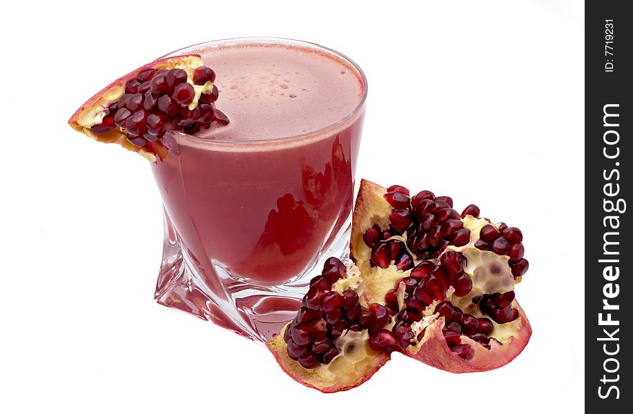 Glass of pomegranate juice and pomegranate grain isolated on a white background. Glass of pomegranate juice and pomegranate grain isolated on a white background