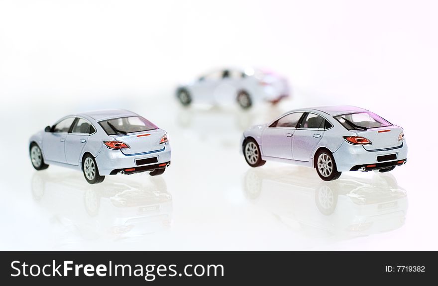 Three model's of car on glass material. Three model's of car on glass material