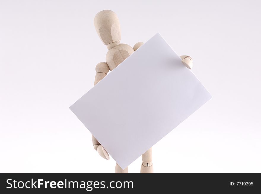Wooden man holding paper note  isolated on white background