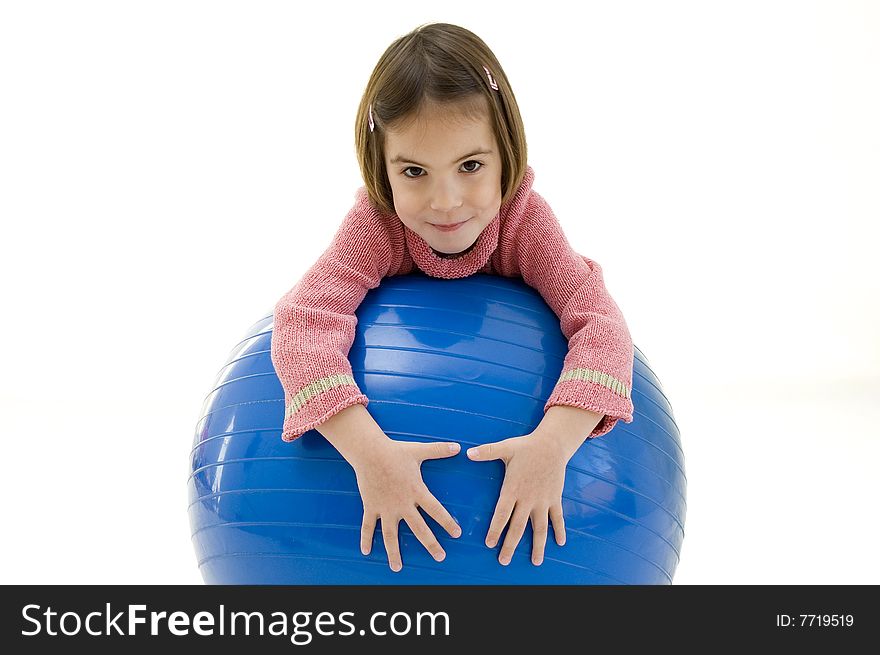 Little girl with a big blue ball isolated on white background