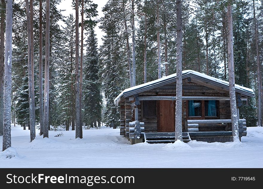 Wood cabin. winter. trees and snow.