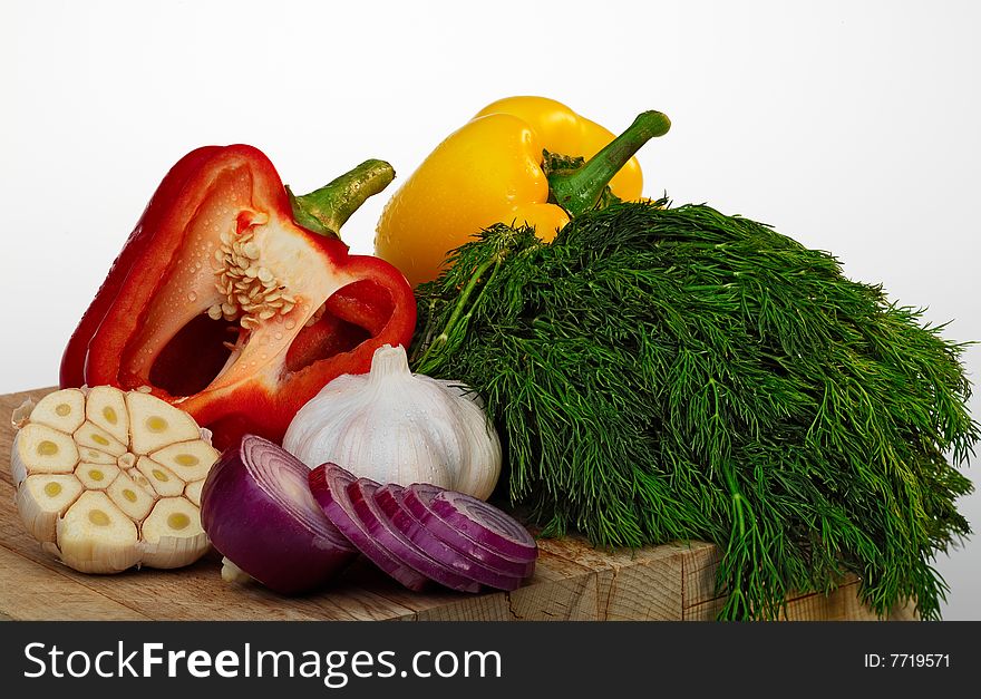 Still-life with fresh vegetables on a white background.