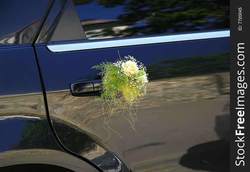 Limousine decorated with flowers near the wedding ceremony. Limousine decorated with flowers near the wedding ceremony