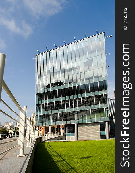 Modern architecture with glass facade on sky background