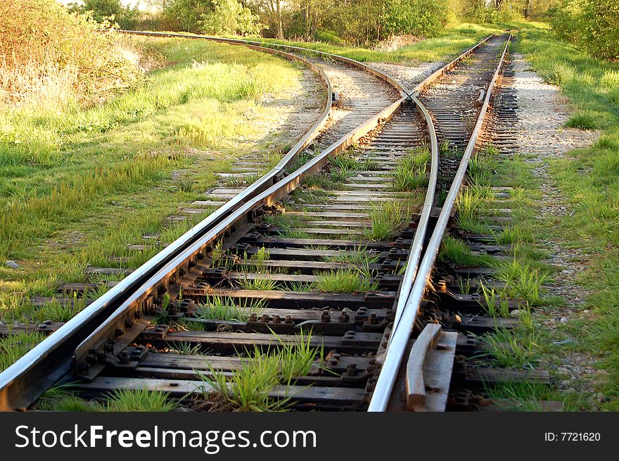 Railway tracks curving and splitting into two separate tracks. Railway tracks curving and splitting into two separate tracks