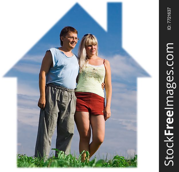 Attractive young woman and her handsome boyfiend in house under blue sky