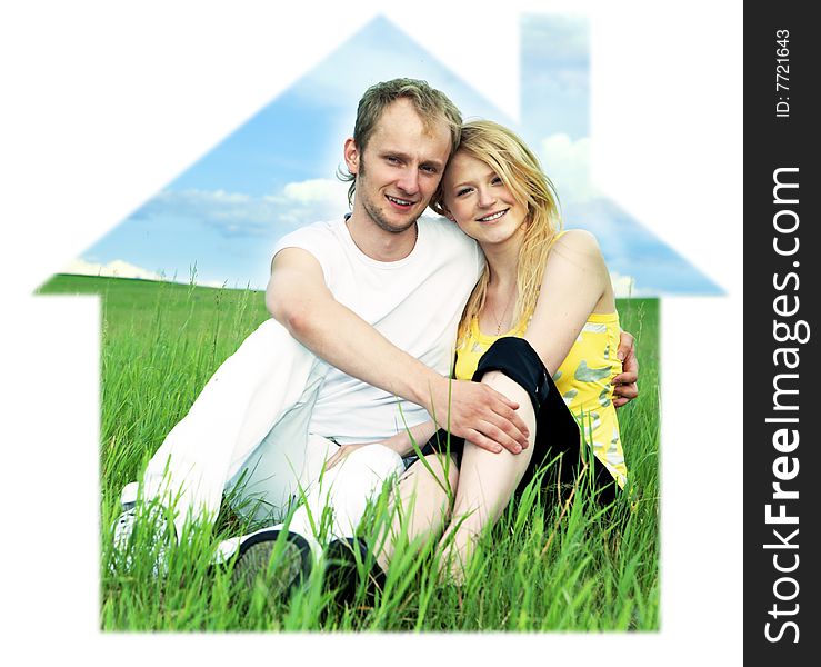 Man and woman in house on green field  under blue sky. Man and woman in house on green field  under blue sky