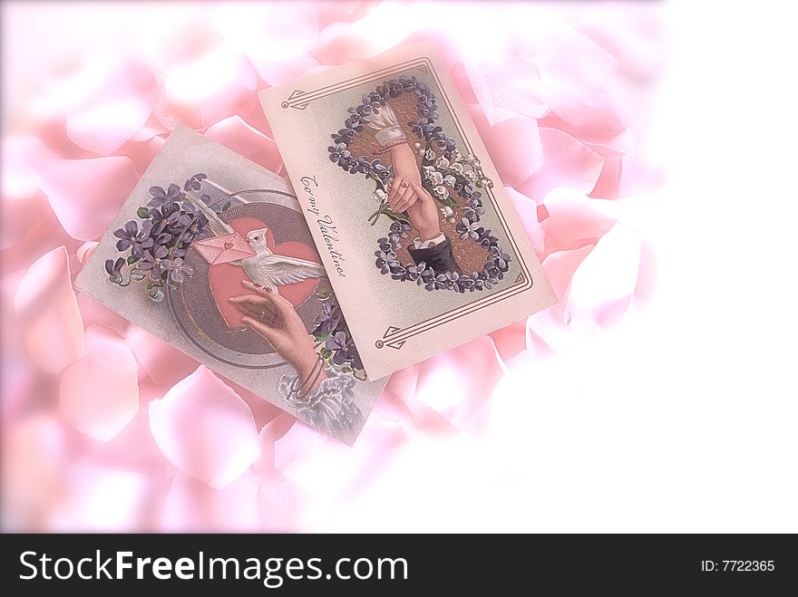 Soft Focus, old fashioned cards on a bed of pink roses. Soft Focus, old fashioned cards on a bed of pink roses