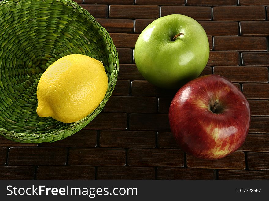 Varied fruits and vegetables, yellow lemon and apple