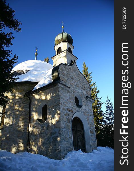 Chappel in the snow and mountain in tirol