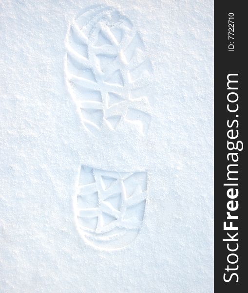 Footprint on white clean snow. Footprint on white clean snow