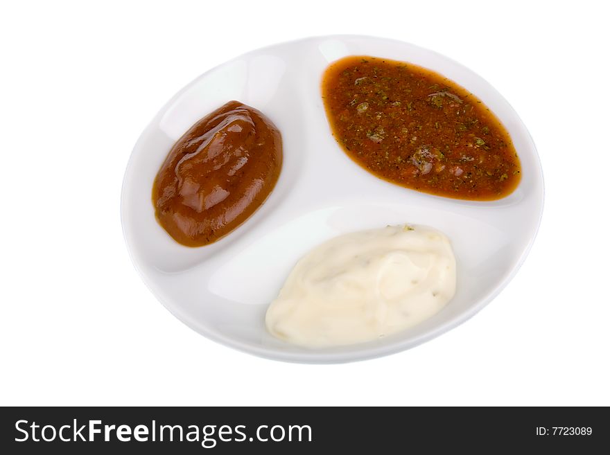 Assortment of sauces over white background