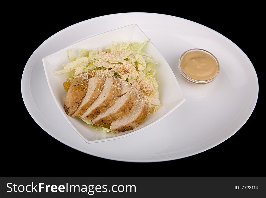 Meat With Vegetables Over Black Background