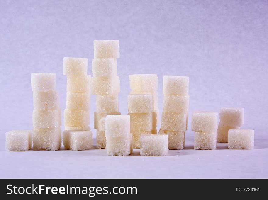 Lump sugar close-up isolated on a white background