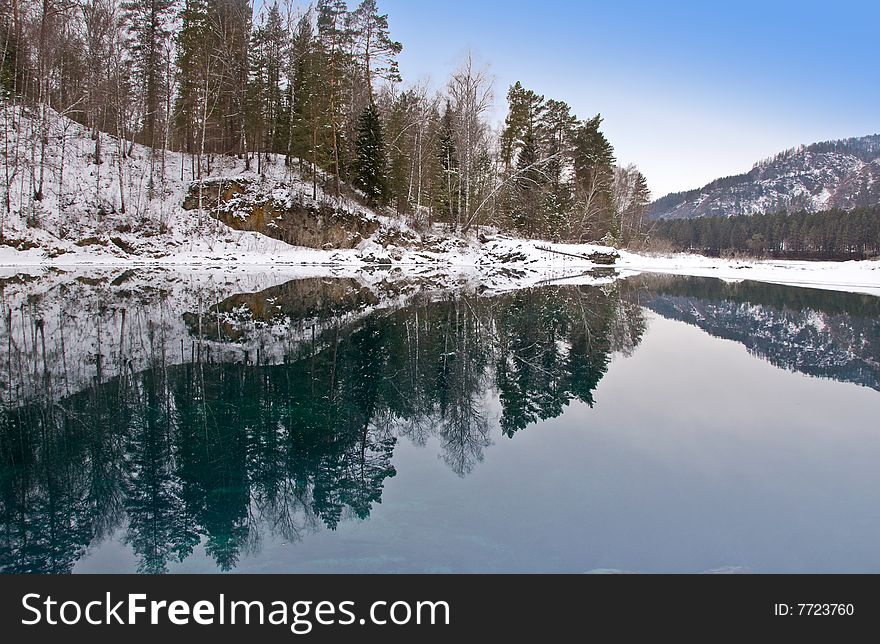 Blue warm nonfreezing lake in Mountain Altai.