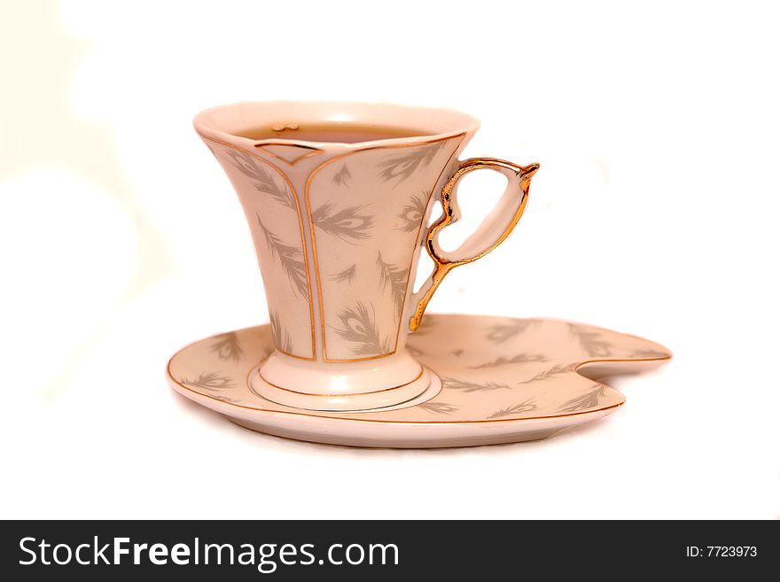Cup on a saucer with tea
