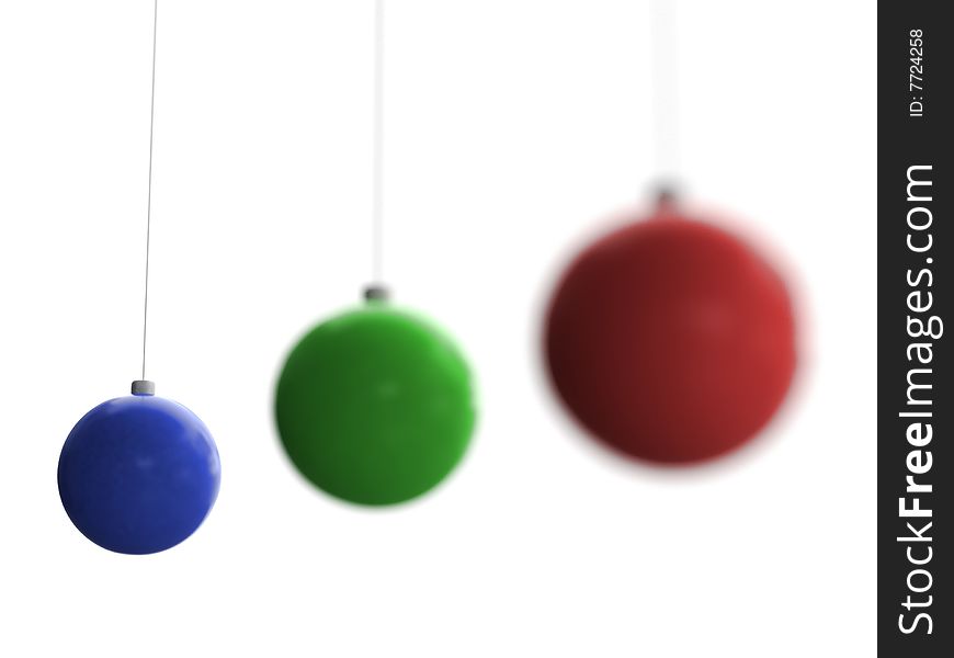 Three Christmas toys of blue, green and red color with last one in focus hanging on white background. Three Christmas toys of blue, green and red color with last one in focus hanging on white background