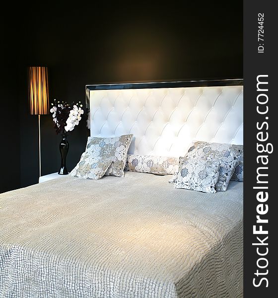 Luxury bed in interior in contemporary style. Luxury bed in interior in contemporary style