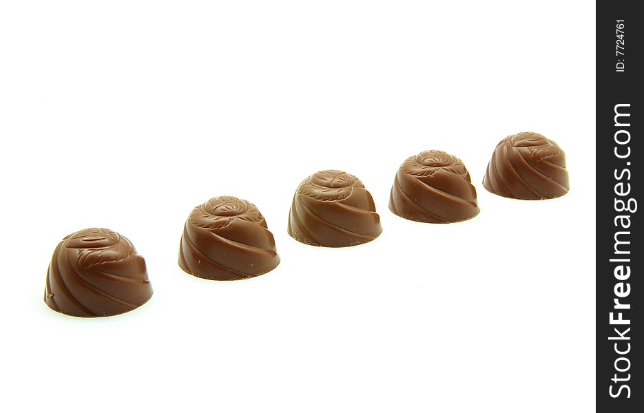Delicious chocolate pralines isolated on white. Delicious chocolate pralines isolated on white