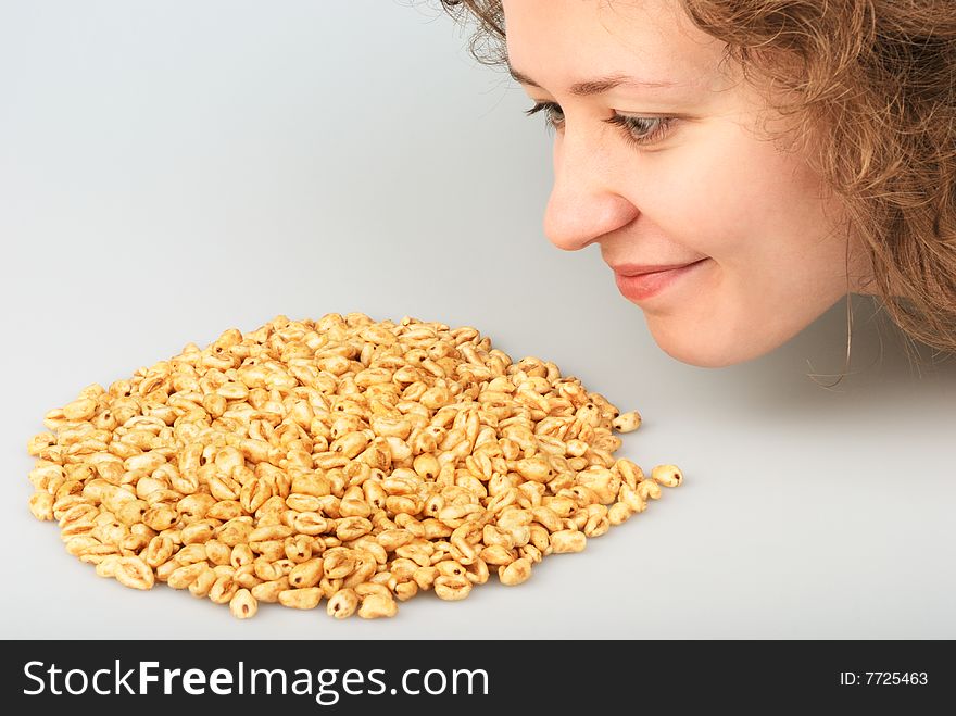 Ppopped wheat grains and beautiful girl. Ppopped wheat grains and beautiful girl