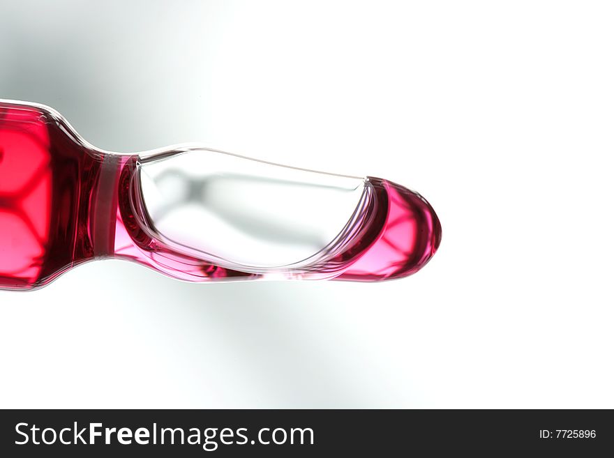 Glass ampoule with red liquid medicine inside