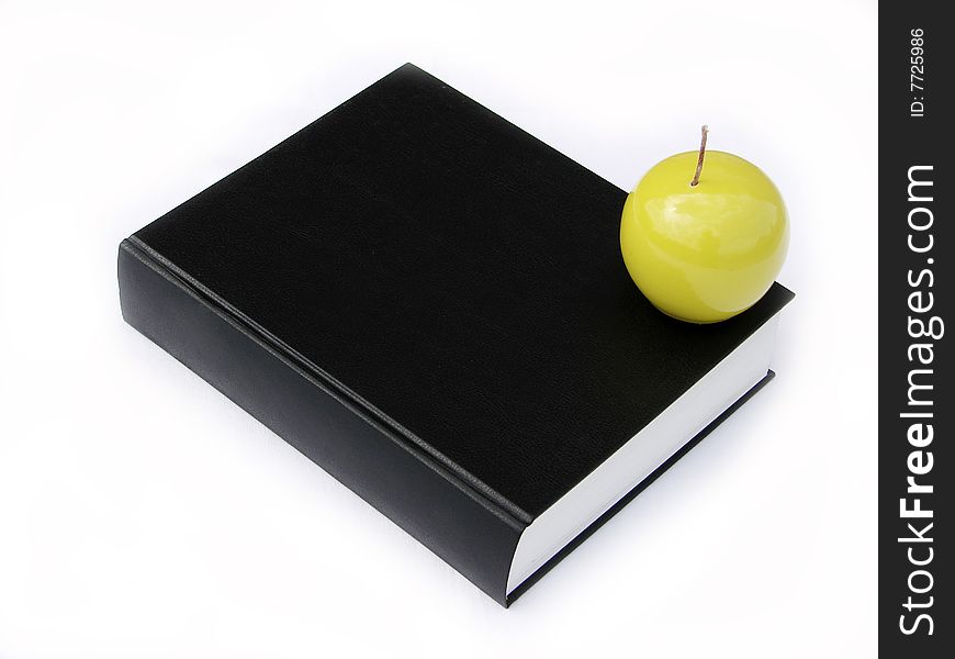 Green apple and stack of books