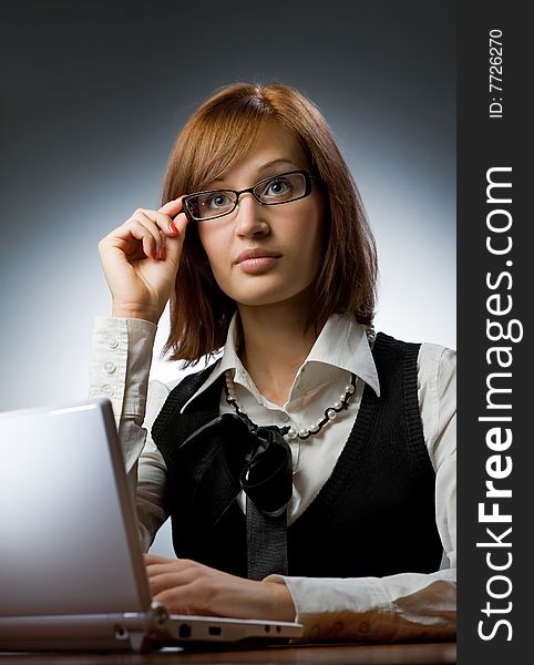 Beautiful young woman working on her laptop