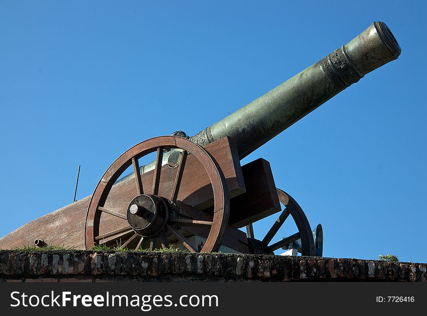 Antique cannon with blue clear sky as background. Antique cannon with blue clear sky as background