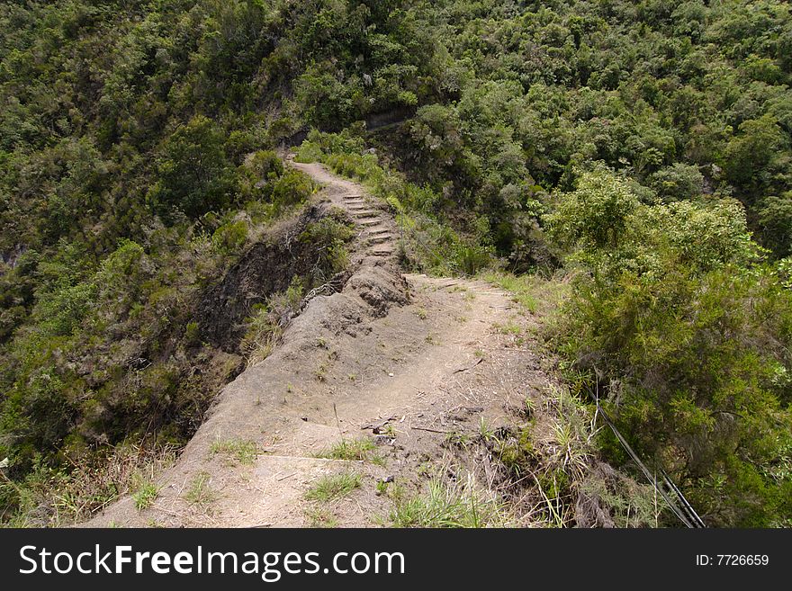 Hiking trail surrounded by precipices, Reunion Island