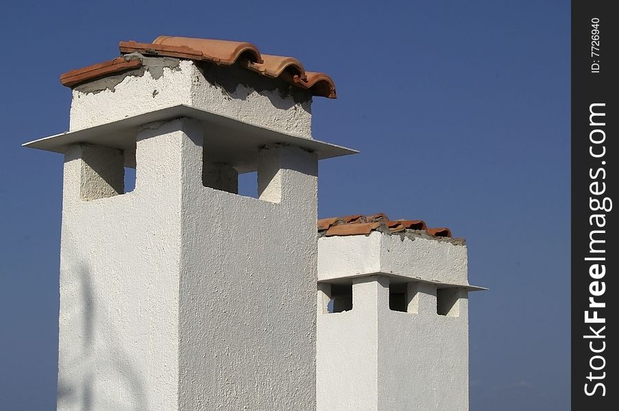 Сhimneys on the roof in Crete, Greece