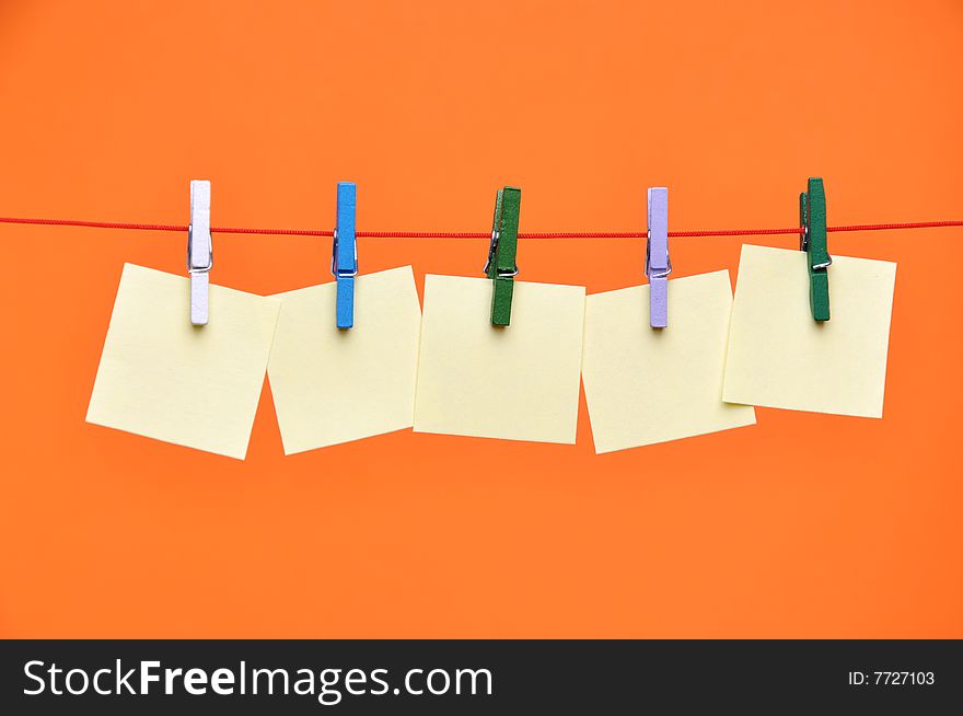 Paper Blanks Hanging on a Rope Held By Clothespins