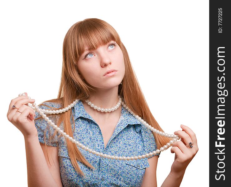 Young girl holding a necklace on white background