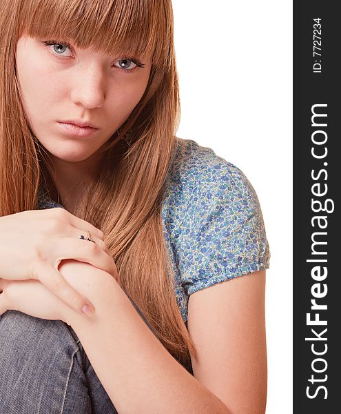 Young girl holding her knee on white background