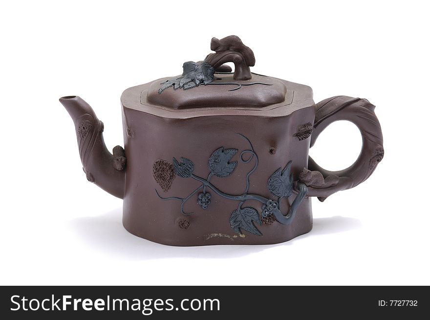 Isolated clay teapot on white background